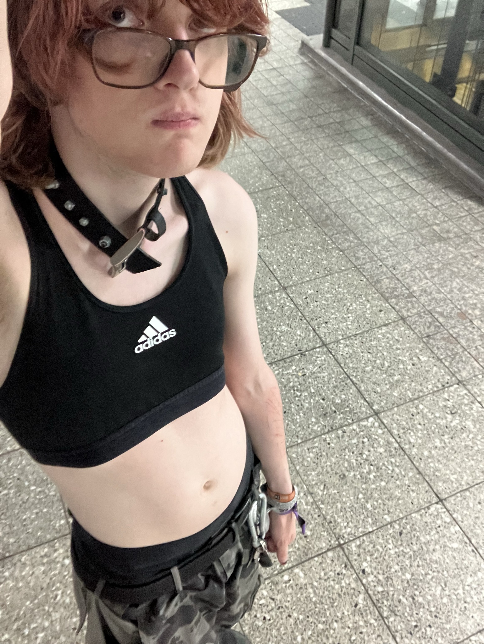 selfie at a tram station in a sports bra and the engelbert strauss camp pants
